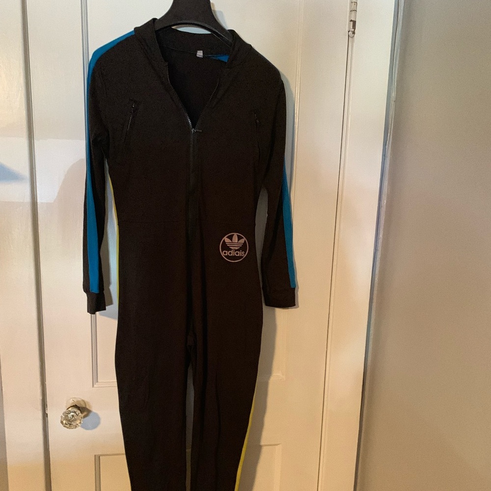 Fashion jumpsuit, multi colored spandex.  Large fits sizes 10-14 comfortably